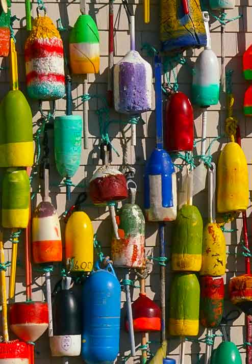 closeup of colorful lobster buoys on the west side of Cap'n Cass Restaurant